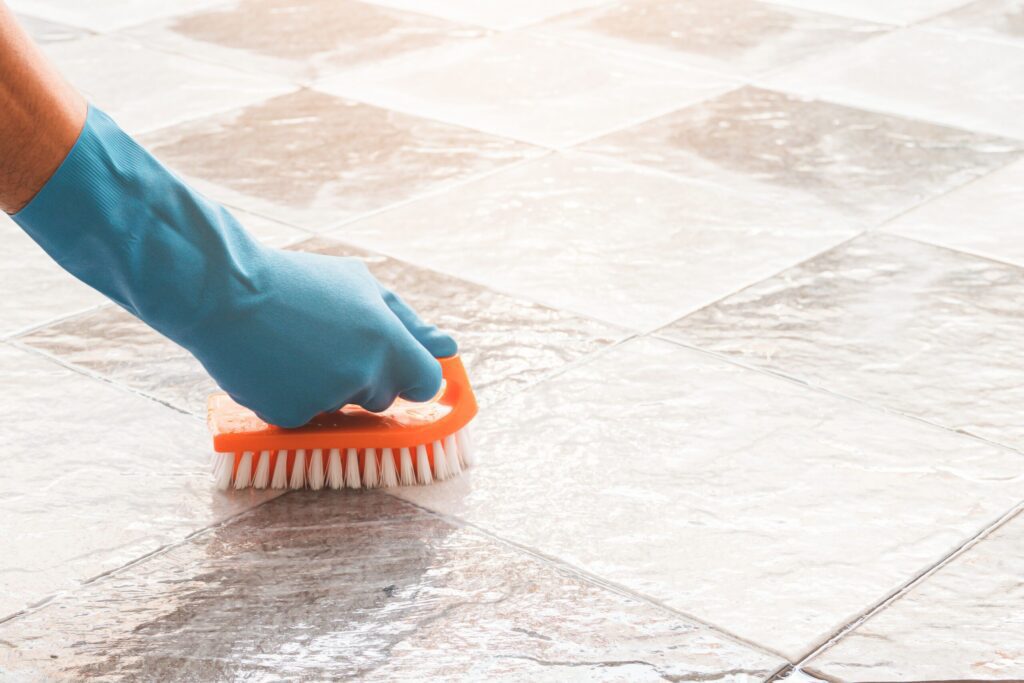 Tile cleaning with cleaning brush